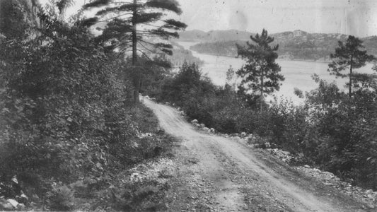 The road into Willisville with Frood Lake on the right, 1930s.
